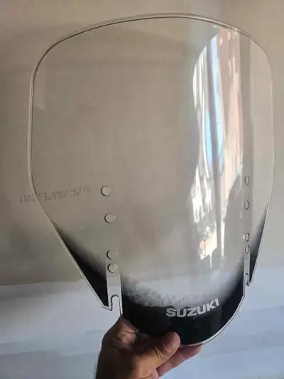 Enhance your riding experience with this Suzuki V-Strom Windscreen, designed to provide optimal wind...