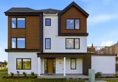 Welcome to this beautifully upgraded corner-unit townhome feels more like a semi-detached in Barrhav...
