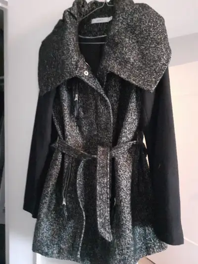Gorgeous Ricki's black winter coat size Medium. Worn once and dry cleaned. Please call or text 647 8...
