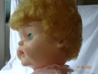 Doll,  toddler  19 inch, dressed nicely, gold hair,nurser mouth,