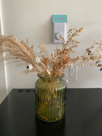 Dried floral arrangements in vintage vases