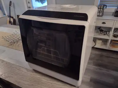 Mini dishwasher. Good for small loads / single person. Fits well on counter tops.