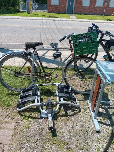 This photo shows one 26" bike that sits firmly in the rack. There are three clamps that move and hol...