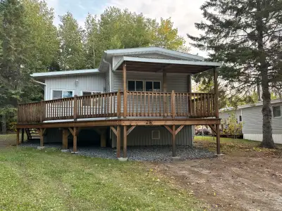 Discover the perfect getaway with this cozy seasonal park model trailer at Tall Timber! This charmin...