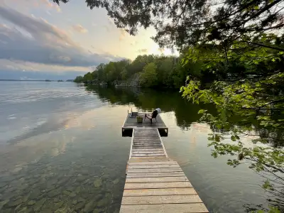 Tucked into a quiet, sheltered bay on beautiful Upper Rideau Lake, this charming 3-season cottage of...