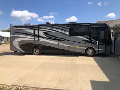 A luxurious and spacious Class A motorhome perfect for long road trips and comfortable living. It’s...