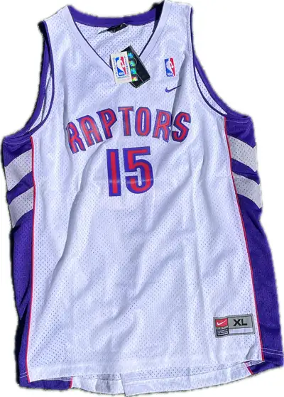 I'm selling a vintage Nike Vince Carter Toronto Raptors Jersey, size XL. This jersey is a classic pi...