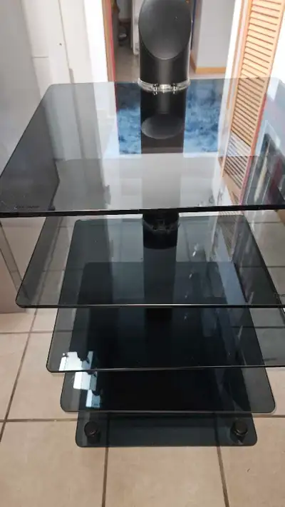 This used glass audio stand features a sleek design with multiple shelves for your audio components....