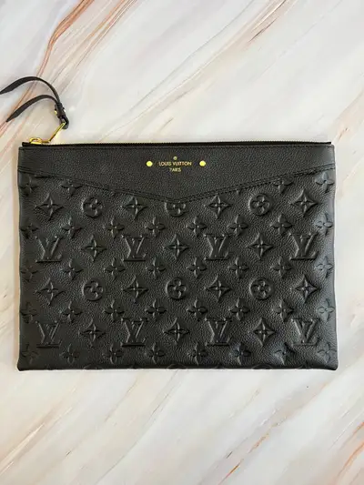 Authentic Louis Vuitton Clutch Black. Purchased for $500. I only purchase quality and authentic piec...
