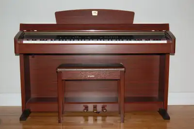 Yamaha Clavinova digital piano and bench in rosewood finish, View more