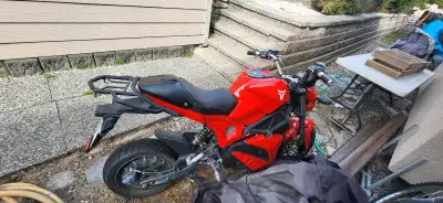 Get ready to turn heads with this vibrant red Tao Motor Electric Motorcycle! While it's in used cond...