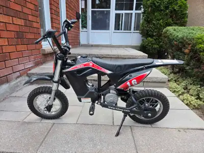 Selling a kids electric dirt bike 36V with a 300W electrical motor. Very little ride time from our t...