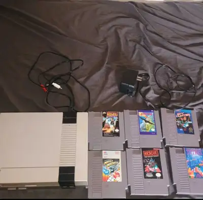 NES console+powercable and games, View more
