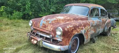 Nice old 1950 Chev car for landscaping or for parts. Has the motor and all the glass lights, nickel...