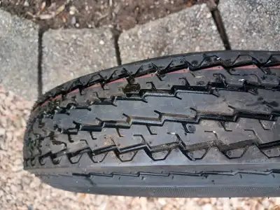 New Trailer tire and new rim Never used 4 bolt pattern Eco trail SE Tire and Rim 5.30 -12 If the ads...