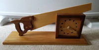 Handmade wooden hand saw clock.