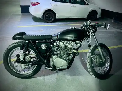 Custom-built, 1973 Honda CL450 Cafe Racer, a true testament to classic motorcycle design blended wit...