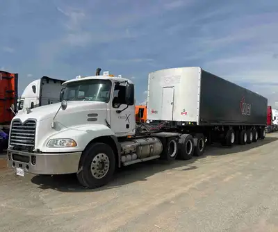 08’ mack heavy haul tri tractor with a 5 axle manac rolltite trailer (no dump trailer but has new pu...