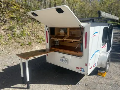 Mint condition, made by a Canadian company, queen-sized sleeping area with comfortable 4” foam cover...