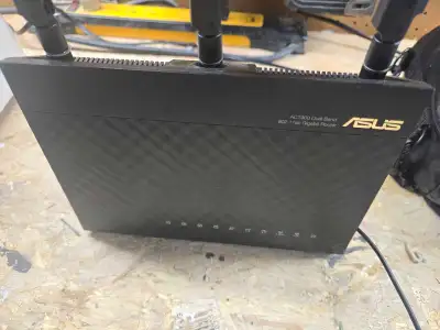 This used Asus AC1900 dual-band Wi-Fi router is perfect for homes needing reliable internet coverage...