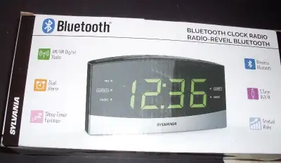 alarm clock again is brand new in box and never plugged into wall this is a Sylvania Bluetooth clock...