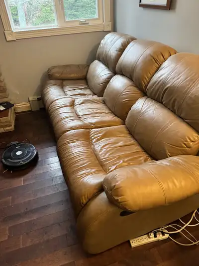 Tan leather reclining sofa, View more