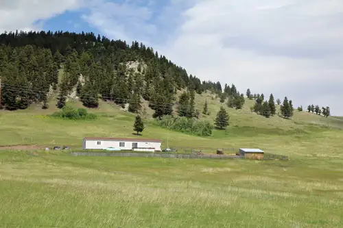 43 acres with a manufactured home accessed from paved Highway 507. The property ascends east to a hi...
