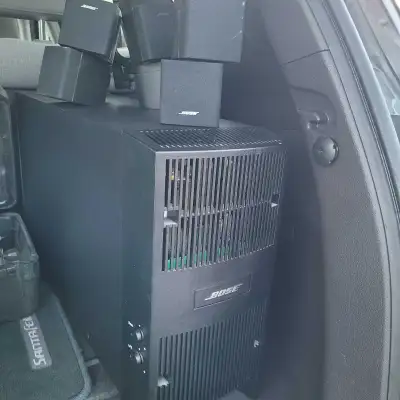 In perfect condition . This is a Bose Subwoofer with 4 surround system speakers