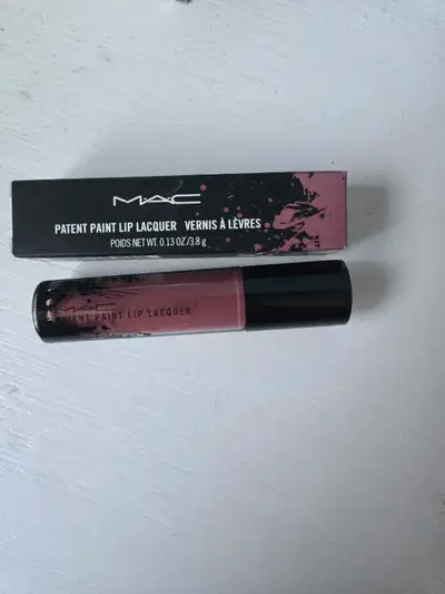 Offering a MAC Patent Paint Lip Lacquer, this cosmetic item promises a high-shine finish and rich co...