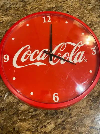Offered for sale is a collectible Coca Cola advertising signs Measures 14” in diameter. Some surface...