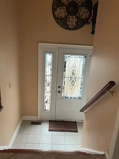 This bright and welcoming house for rent features hardwood flooring throughout the spacious living a...