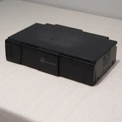 Mercedes Cd Changer MC3010 MC3111 MC3110 6 disc changer genuine part. This cd changer is in very goo...