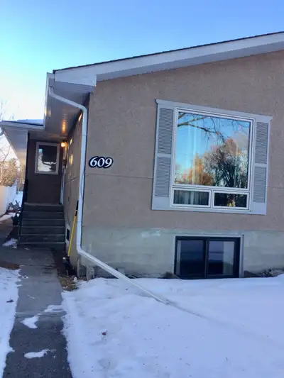 This charming 2-bedroom main floor unit features modern stainless steel kitchen appliances, includin...