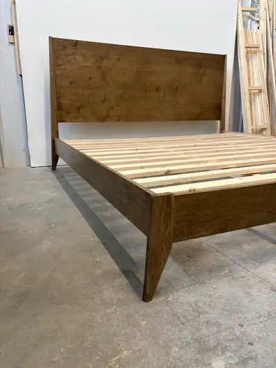 Gorgeous brand new mid century modern bed frame. This bed frame fits a standard king sized mattress...