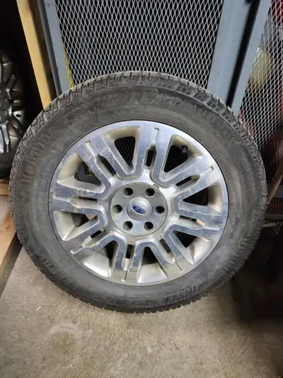 4 275/55 R20 Arctic Claw winter tires on Ford aluminum wheels lug nuts included (F150)