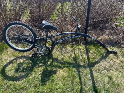 A well loved trail-a-bike ready to bring joy to new kids and parents. All is complete and functionin...