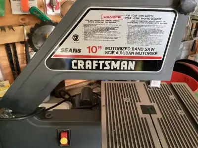 This is a Craftsman 10-inch band saw, perfect for any home workshop. It's in good working condition...