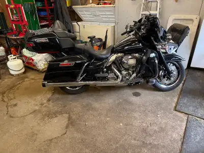 I'm selling my black Harley-Davidson touring motorcycle, which offers a smooth ride and iconic styli...