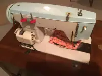 Sewing machine with cabinet 