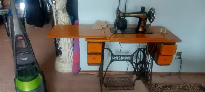 good singer sewing machine comes with table modle m27 150$, View more