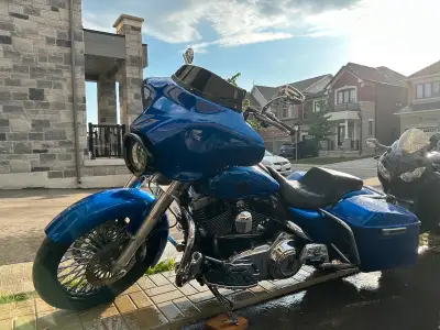 Custom paint, stretched bags, ape hangers, Bluetooth radio, newer tires and new brakes, custom front...