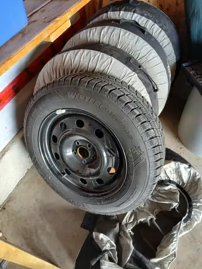 Set of 4 with pressure sensor rims and covers. Less than 3,000 kms.