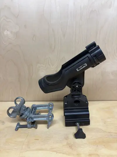Scotty Powerlock rod holder with a combination side/deck mount rod holder. Silver rod holder on the...
