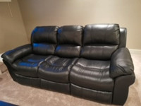 Barely used genuine leather reclining sofa in black color $800