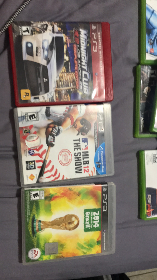 ps3 and one ps2 game  in Sony Playstation 3 in Barrie
