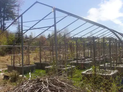 96 feet long by 30 feet wide 14 feet high , heavy duty greenhouse frame for sale, you dismantle. Rol...