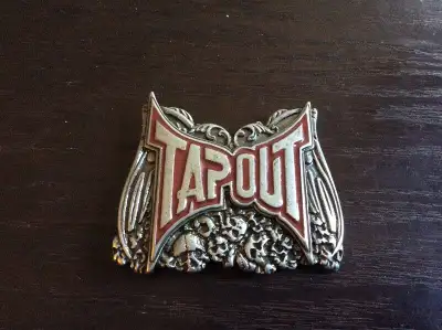 New Never Used. Metal TAPOUT Belt Buckle