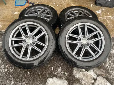 Set of 4 gun-metal grey alloy wheels with BF Goodrich winter T/A tires Had 5000kms on an Ecoboost Mu...