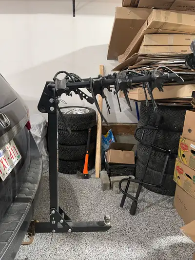 Hitch mounted bike rack for four bikes. Post tilts for access to hatch of van. Has a ball hitch so y...
