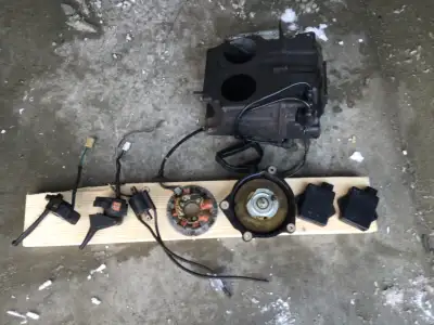 Parts from a 1994/ 95 Yamaha vmax 600. (2) cdi, (2) coils, air box, handlebar controls, stator, reco...